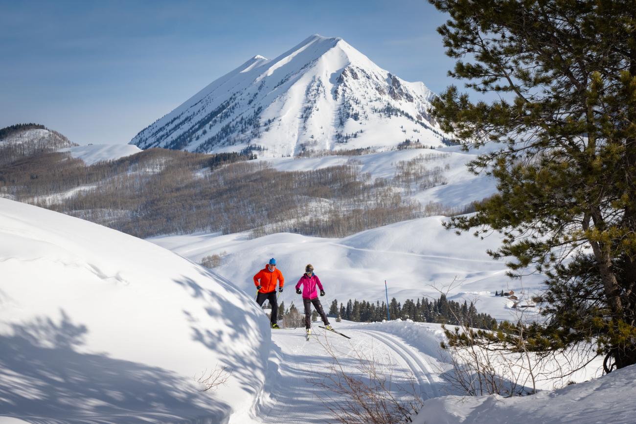 Two nordic skiers on the groomed trails at Crested Butte