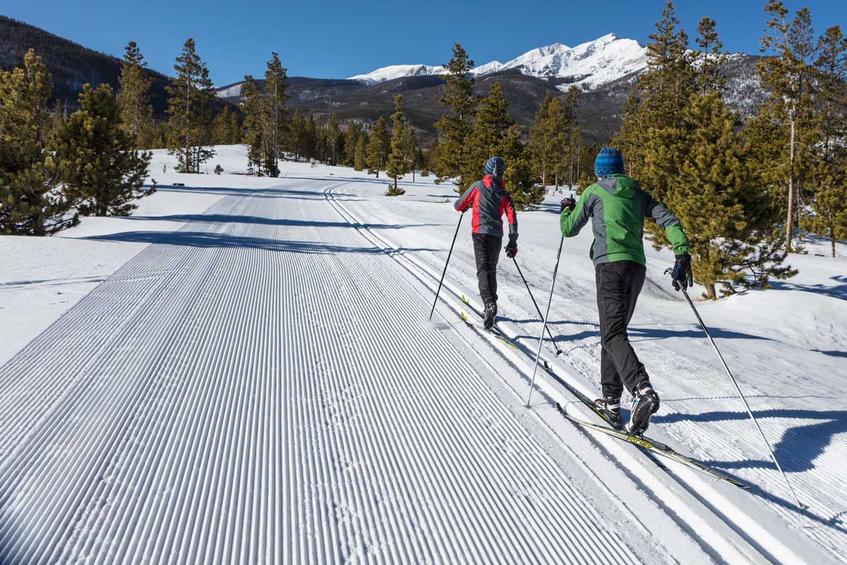 Two young boys nordic skiing on the trails at Frisco Nordic Center