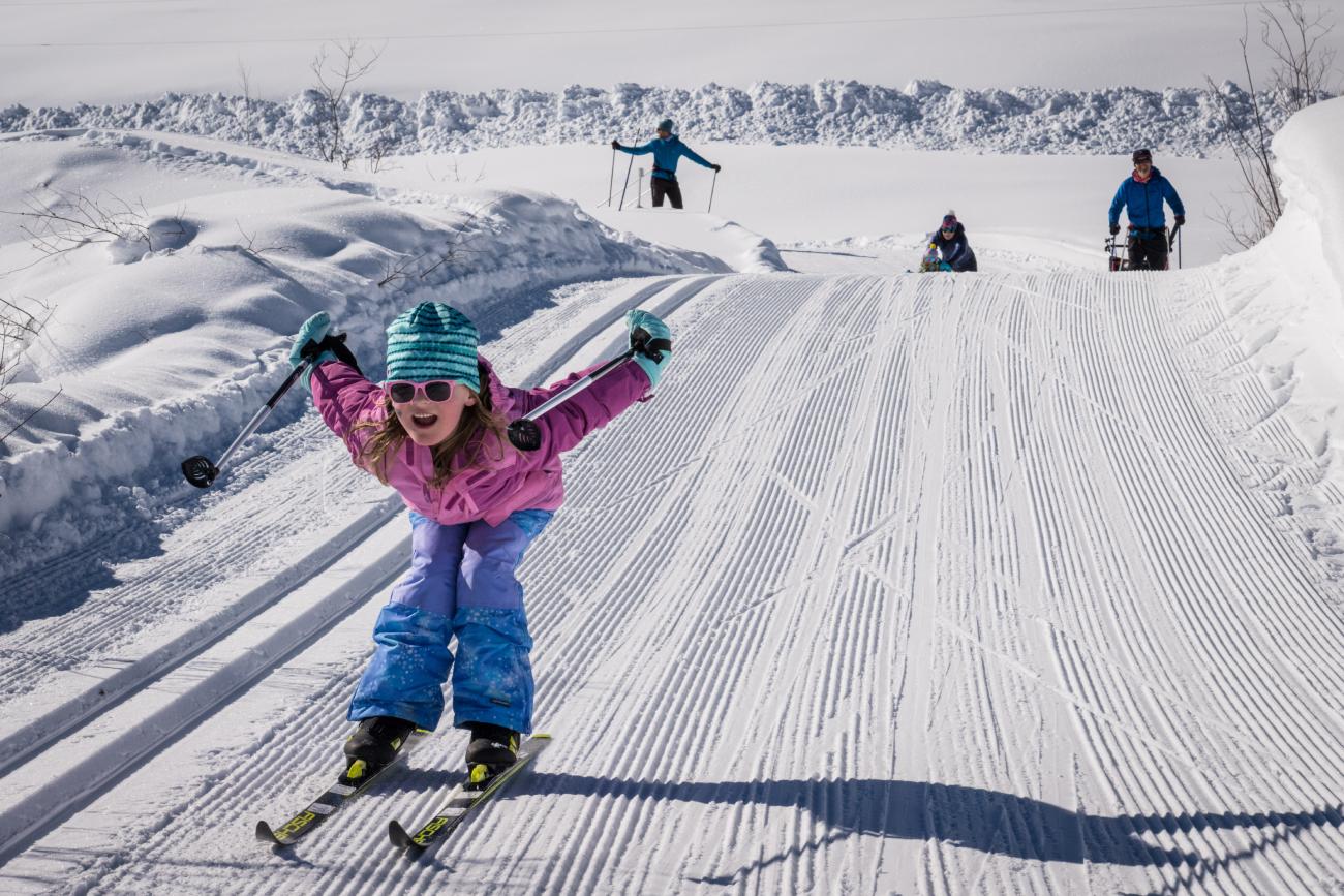 Young skier racing down the trail at Crested Butte